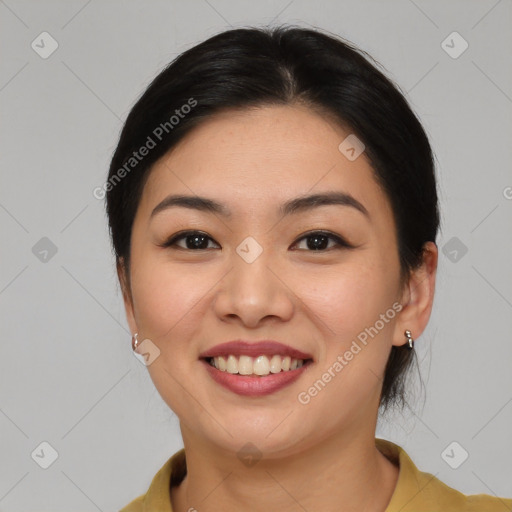 Joyful asian young-adult female with medium  brown hair and brown eyes