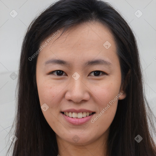 Joyful asian young-adult female with long  brown hair and brown eyes