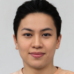 Joyful asian young-adult female with short  brown hair and brown eyes