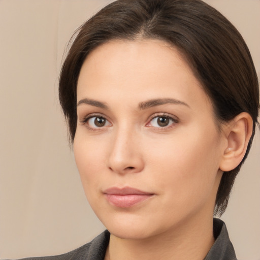 Neutral white young-adult female with medium  brown hair and brown eyes