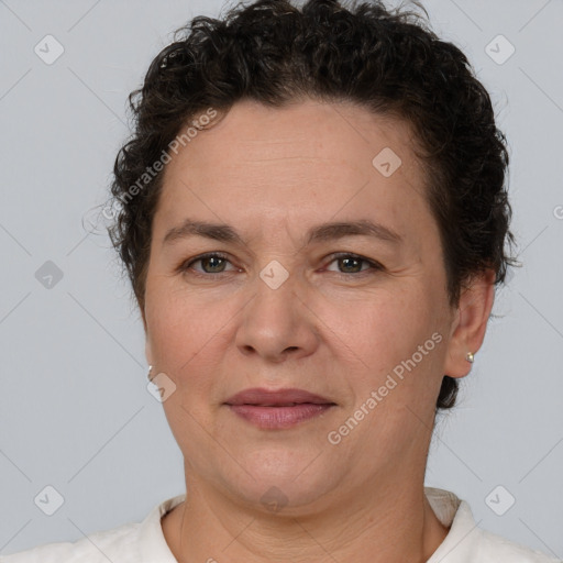 Joyful white adult female with short  brown hair and brown eyes