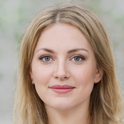 Joyful white young-adult female with medium  brown hair and green eyes