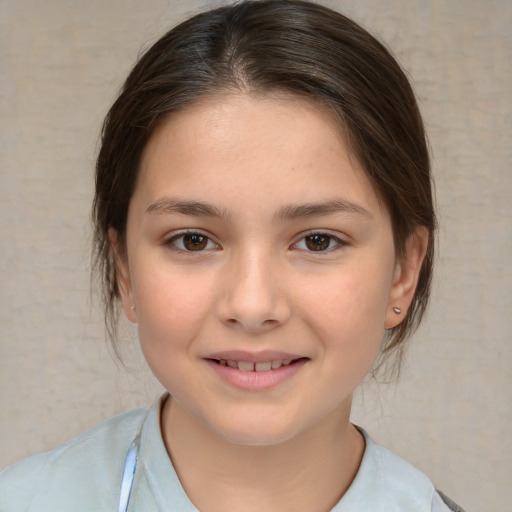 Joyful white child female with medium  brown hair and brown eyes