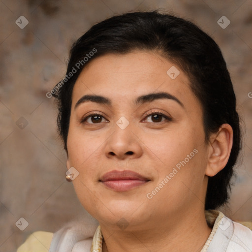 Joyful latino young-adult female with medium  brown hair and brown eyes