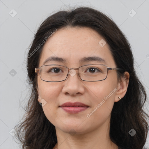 Joyful white adult female with medium  brown hair and brown eyes