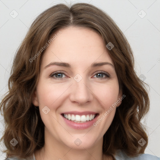 Joyful white young-adult female with long  brown hair and green eyes