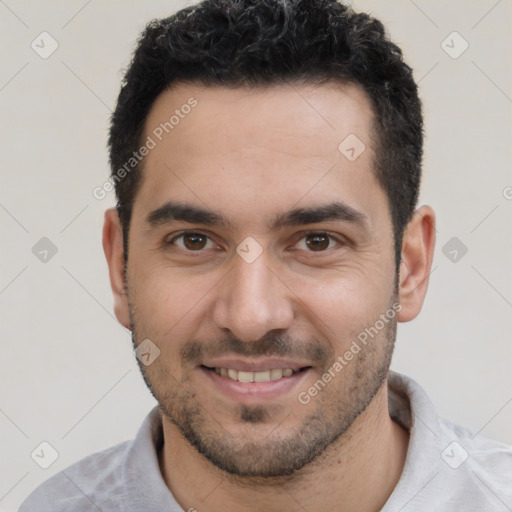 Joyful white young-adult male with short  black hair and brown eyes