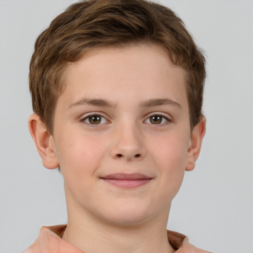 Joyful white child male with short  brown hair and brown eyes