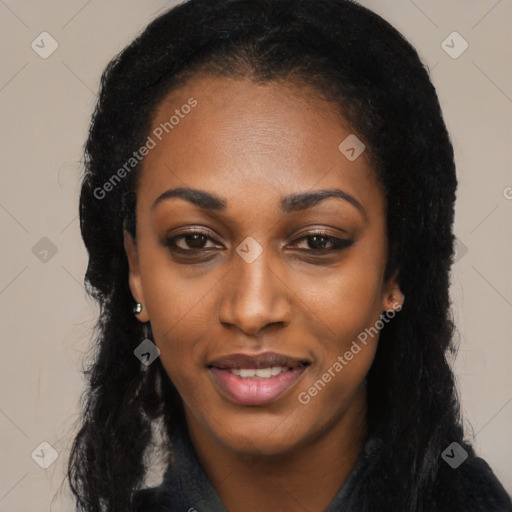 Joyful black young-adult female with long  black hair and brown eyes