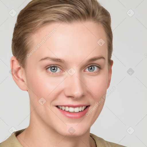 Joyful white young-adult female with short  brown hair and grey eyes