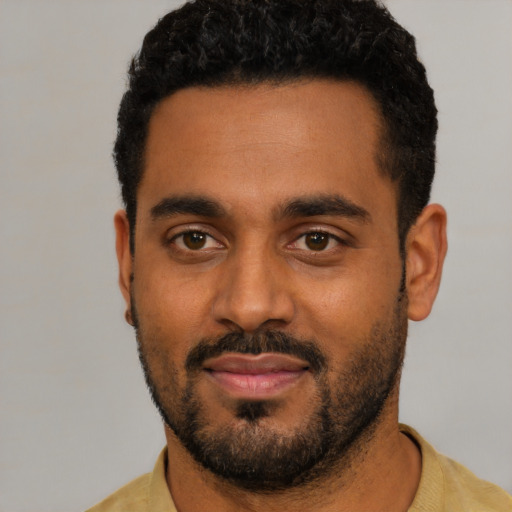 Neutral black young-adult male with short  black hair and brown eyes