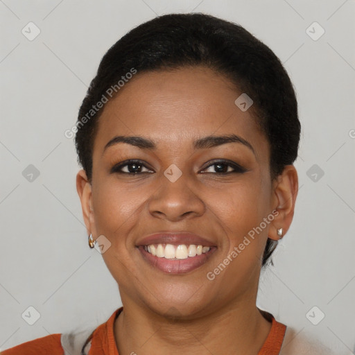 Joyful black young-adult female with short  brown hair and brown eyes