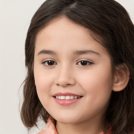 Joyful white child female with medium  brown hair and brown eyes