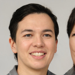 Joyful white young-adult male with medium  brown hair and brown eyes