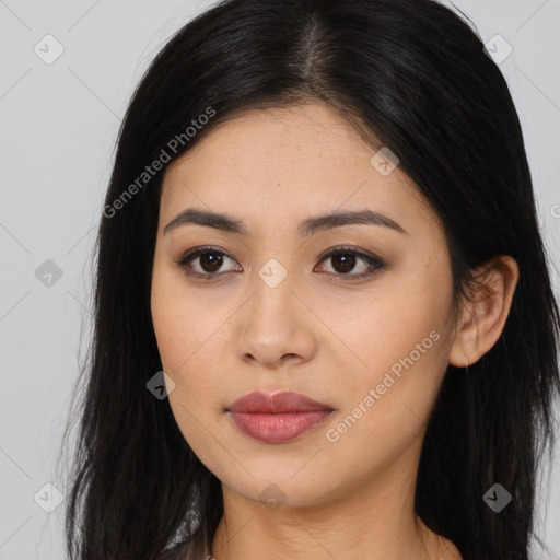 Joyful asian young-adult female with long  brown hair and brown eyes