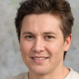 Joyful white adult male with short  brown hair and brown eyes