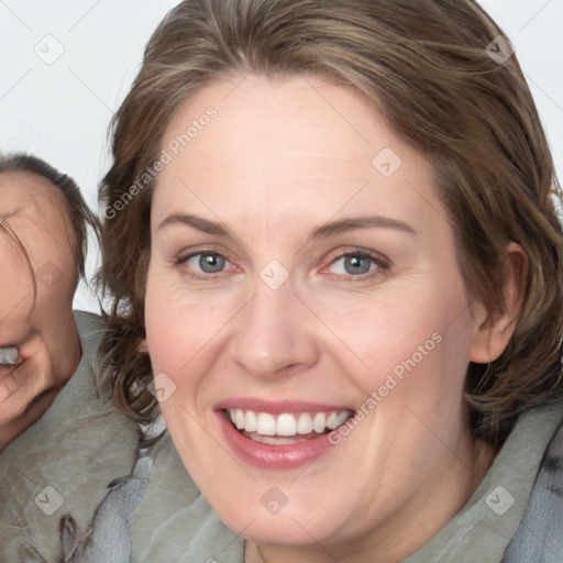 Joyful white adult female with medium  brown hair and blue eyes