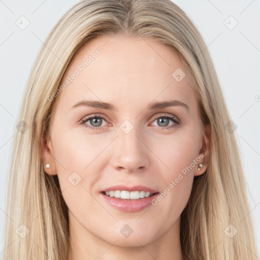 Joyful white young-adult female with long  brown hair and blue eyes