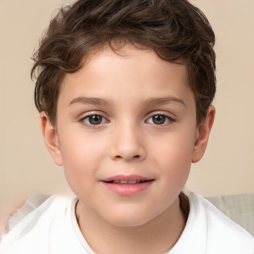 Joyful white child male with short  brown hair and brown eyes