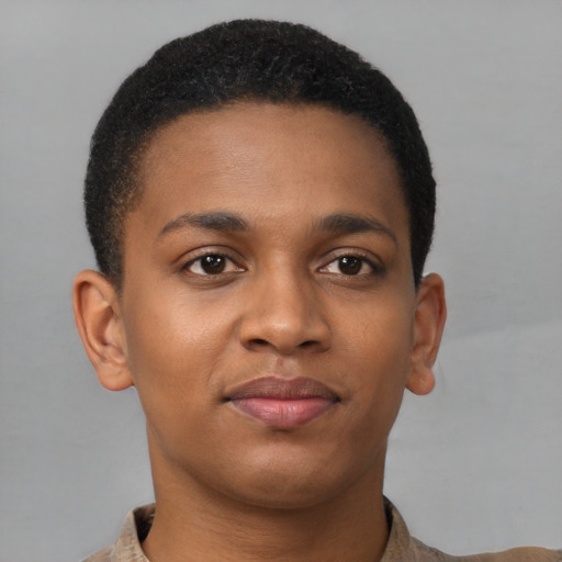 Joyful latino young-adult male with short  brown hair and brown eyes