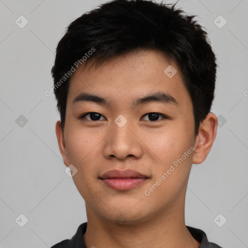 Joyful asian young-adult male with short  black hair and brown eyes