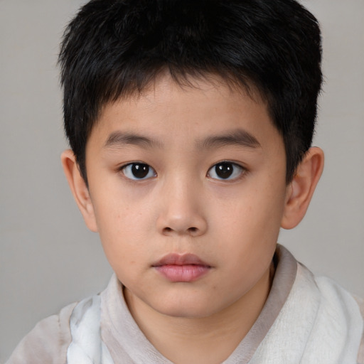 Neutral asian child male with short  brown hair and brown eyes