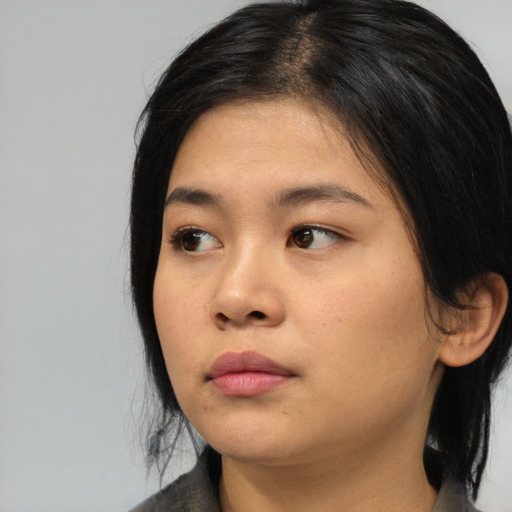 Neutral asian young-adult female with medium  black hair and brown eyes