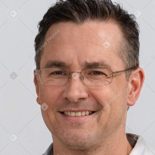 Joyful white adult male with short  brown hair and grey eyes