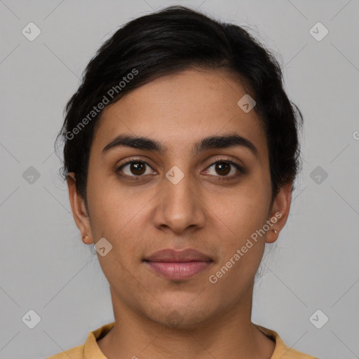 Joyful latino young-adult female with short  brown hair and brown eyes