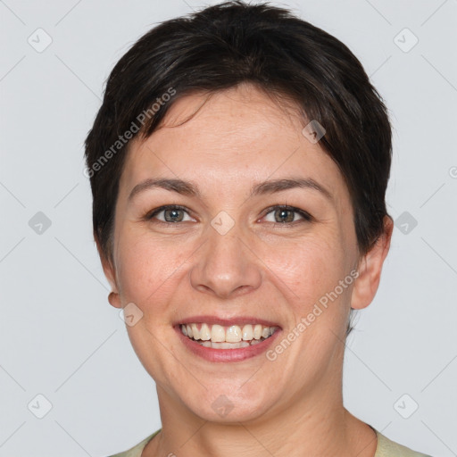 Joyful white young-adult female with short  brown hair and grey eyes