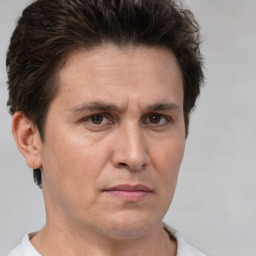 Neutral white adult male with short  brown hair and brown eyes