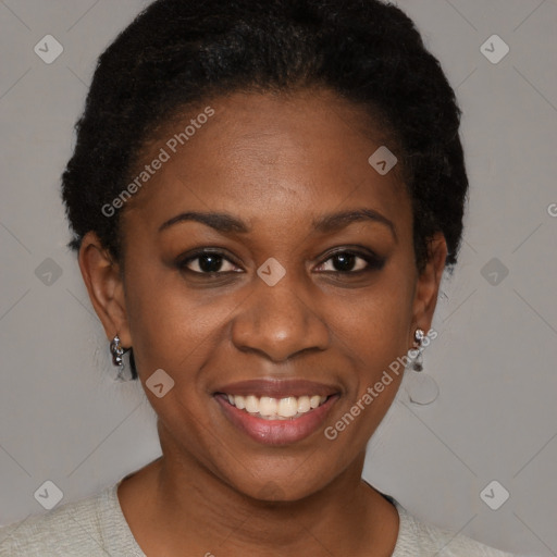 Joyful black young-adult female with short  brown hair and brown eyes