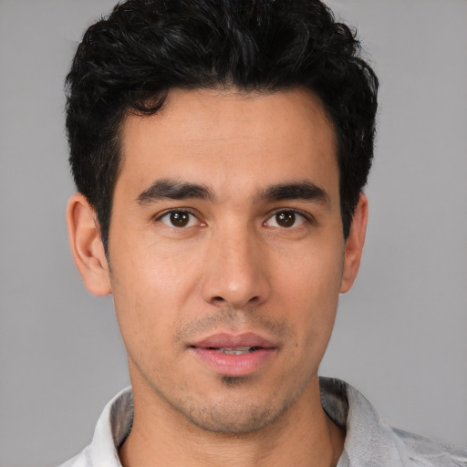 Neutral white young-adult male with short  black hair and brown eyes