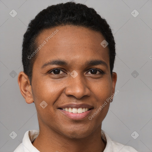 Joyful black young-adult male with short  brown hair and brown eyes