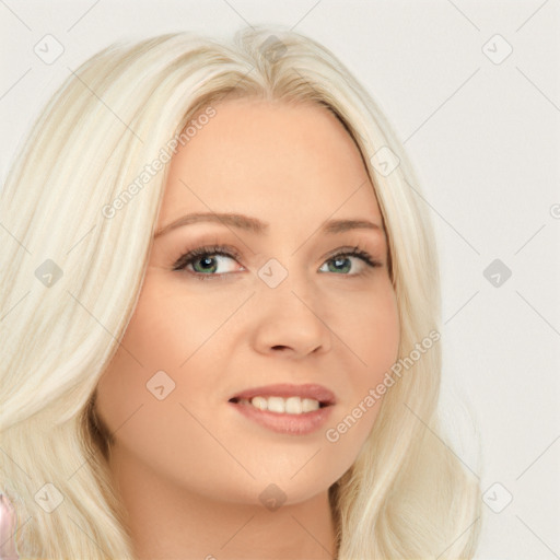 Joyful white young-adult female with long  blond hair and blue eyes