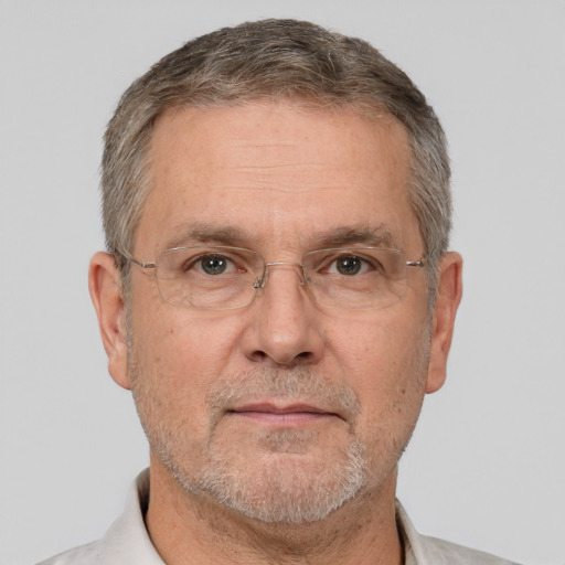 Neutral white middle-aged male with short  gray hair and brown eyes