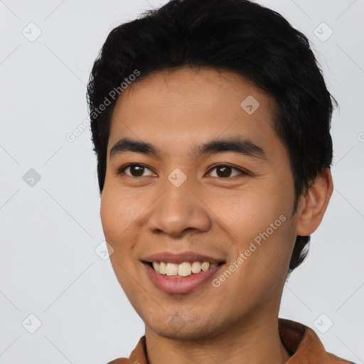 Joyful asian young-adult male with short  black hair and brown eyes