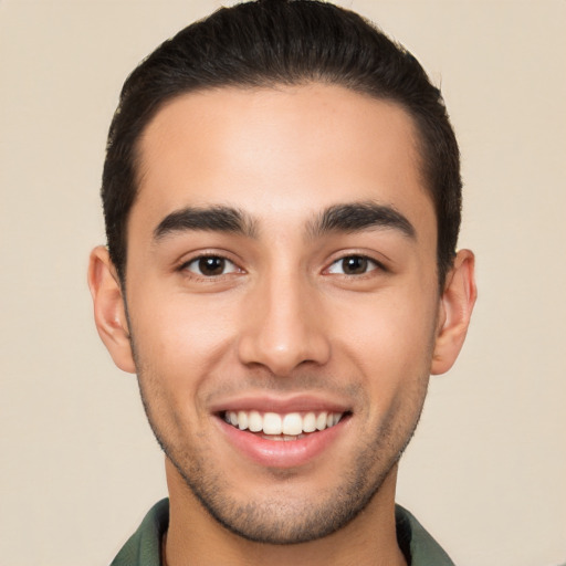 Joyful white young-adult male with short  brown hair and brown eyes