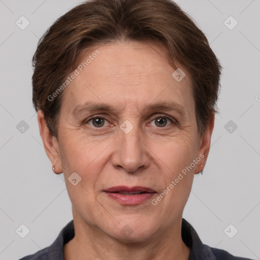 Joyful white adult female with short  brown hair and grey eyes