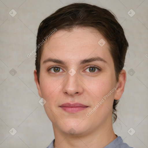 Joyful white young-adult female with short  brown hair and grey eyes