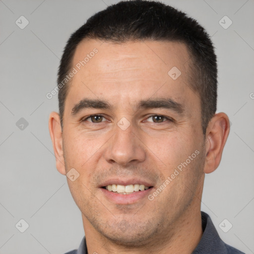 Joyful white adult male with short  brown hair and brown eyes