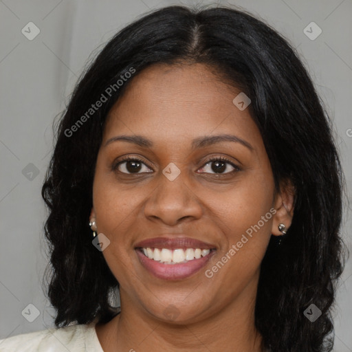 Joyful black young-adult female with long  brown hair and brown eyes