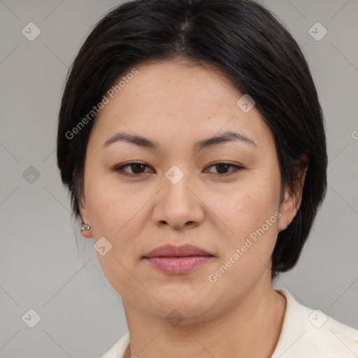 Joyful asian adult female with medium  brown hair and brown eyes