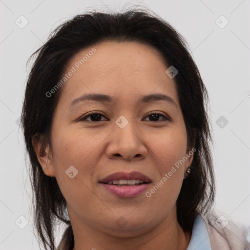 Joyful asian adult female with medium  brown hair and brown eyes