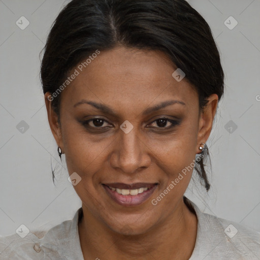 Joyful black adult female with medium  brown hair and brown eyes