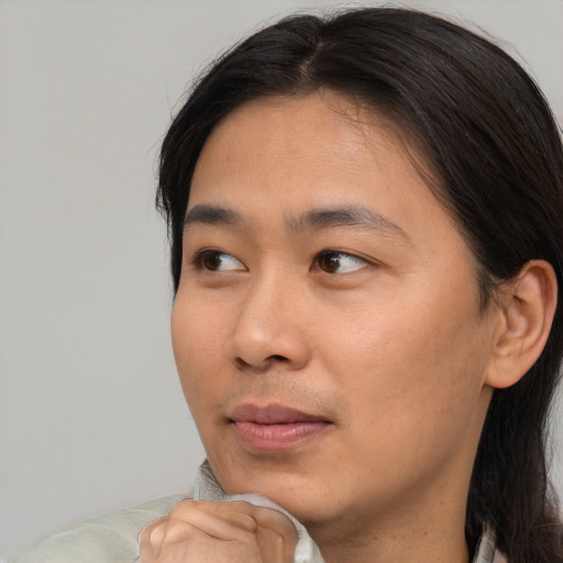 Neutral asian young-adult male with short  brown hair and brown eyes