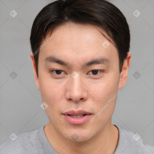 Neutral asian young-adult male with short  brown hair and brown eyes