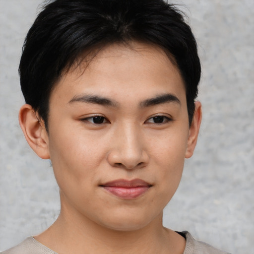 Joyful asian young-adult female with short  black hair and brown eyes