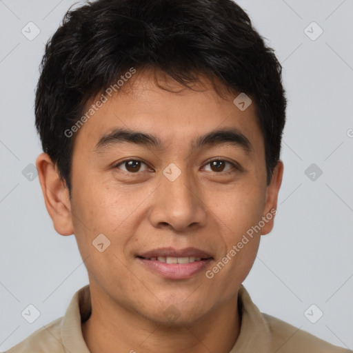 Joyful latino young-adult male with short  brown hair and brown eyes