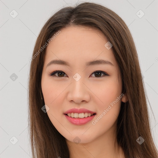 Joyful asian young-adult female with long  brown hair and brown eyes